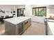 Gourmet kitchen with island, stainless steel appliances, and hardwood floors at 62 Jasmine St, Denver, CO 80220