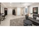 Spacious basement living room featuring a comfortable sectional sofa, rug, and entertainment area at 62 Jasmine St, Denver, CO 80220