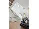 Bright living room with hardwood floors, modern staircase, and comfortable seating at 62 Jasmine St, Denver, CO 80220