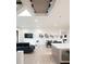 Spacious living area with hardwood floors, modern art, and open floor plan to kitchen at 62 Jasmine St, Denver, CO 80220