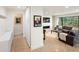 Bright living space featuring modern decor and fireplace with a large window at 62 Jasmine St, Denver, CO 80220