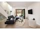 Bright living room with modern decor and an open floor plan leading to the outdoors at 62 Jasmine St, Denver, CO 80220