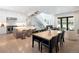 Open concept living space featuring a kitchen, dining area and living area with a staircase in the background at 62 Jasmine St, Denver, CO 80220