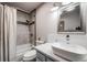 Updated bathroom with tiled shower and modern sink at 12956 W Virginia Ave, Lakewood, CO 80228
