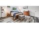 Comfortable bedroom with wood floors and large window at 12956 W Virginia Ave, Lakewood, CO 80228