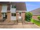 Two-story brick townhouse with front yard landscaping at 12956 W Virginia Ave, Lakewood, CO 80228