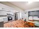 Bright kitchen with stainless steel appliances and washer dryer at 12956 W Virginia Ave, Lakewood, CO 80228