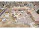 Aerial view of a school with playground, blacktop court, a schoolyard, and adjacent parking at 1436 S Yates St, Denver, CO 80219