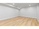 Unfinished basement area with light wood-look floors and pot lighting at 1436 S Yates St, Denver, CO 80219