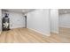 Spacious basement features light wood-look floors, a gray water heater, and utility connections at 1436 S Yates St, Denver, CO 80219