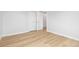 This bright bedroom features a closet and new flooring at 1436 S Yates St, Denver, CO 80219