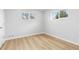 Bedroom featuring neutral paint and flooring, with two large windows at 1436 S Yates St, Denver, CO 80219