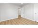 Bright bedroom with light wood floors and white trim offers a simple, clean aesthetic at 1436 S Yates St, Denver, CO 80219