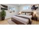 Cozy bedroom with a king-size bed, wood accents, and soft lighting at 1436 S Yates St, Denver, CO 80219