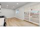 Spacious kitchen with stainless appliances and sliding door to patio at 1436 S Yates St, Denver, CO 80219