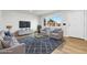 Bright living room with modern furnishings, large window, and stylish rug at 1436 S Yates St, Denver, CO 80219