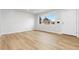Bright living room with modern flooring and large window at 1436 S Yates St, Denver, CO 80219