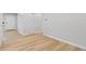 Modern living room featuring updated flooring and neutral color scheme at 1436 S Yates St, Denver, CO 80219