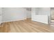Bright living area with light flooring, neutral walls, and lots of sunlight at 1436 S Yates St, Denver, CO 80219