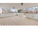 Wide-angle view of covered patio with wooden deck and open views of the surrounding neighborhood at 1436 S Yates St, Denver, CO 80219