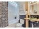 Well-designed bathroom featuring a unique sink, stylish fixtures, and a shower-tub combination at 4910 W 34Th Ave, Denver, CO 80212