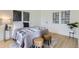 Cozy bedroom with a comfortable bed, neutral decor, and ample natural light at 4910 W 34Th Ave, Denver, CO 80212