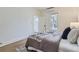 Serene bedroom with soft lighting, neutral decor, and a view of the outdoors at 4910 W 34Th Ave, Denver, CO 80212