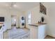 Efficient kitchen area with a stackable washer/dryer unit and an eat-in counter at 4910 W 34Th Ave, Denver, CO 80212