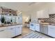 Bright kitchen featuring white cabinets, wood countertops, and stainless steel appliances at 4910 W 34Th Ave, Denver, CO 80212