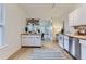 Spacious kitchen featuring white cabinets, wood countertops, and stainless steel appliances at 4910 W 34Th Ave, Denver, CO 80212