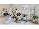 Bright living room featuring neutral decor, hardwood floors, and stylish furnishings at 4910 W 34Th Ave, Denver, CO 80212