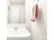 Well-lit bathroom with modern sink and hardware and decorative towel at 5025 Central Park Blvd, Denver, CO 80238