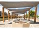 Inviting community space with shaded canopy and outdoor seating at 5025 Central Park Blvd, Denver, CO 80238