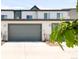 Modern home exterior showing attached garages and neutral siding at 5025 Central Park Blvd, Denver, CO 80238