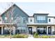 Stylish home featuring a modern design with vertical siding, large windows and a welcoming front porch at 5025 Central Park Blvd, Denver, CO 80238