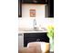Close up of kitchen with dark cabinetry, stainless steel sink and faucet, and quartz countertops at 5025 Central Park Blvd, Denver, CO 80238