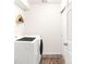 Clean laundry room featuring a washer and dryer next to a sliding door at 5025 Central Park Blvd, Denver, CO 80238