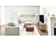 Bright living room with a comfortable sectional sofa, modern decor, and a large window at 5025 Central Park Blvd, Denver, CO 80238