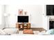 Open living space with stylish decor, featuring a TV on a mid-century modern console at 5025 Central Park Blvd, Denver, CO 80238