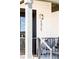 Detailed shot of the address on a well-lit porch with modern seating and black trim at 5025 Central Park Blvd, Denver, CO 80238