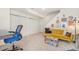 Finished basement showcasing neutral carpet, white walls, and eclectic furniture at 8381 E 29Th Ave, Denver, CO 80238