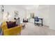 Finished basement area with neutral carpet, white walls, and eclectic decor with desk at 8381 E 29Th Ave, Denver, CO 80238
