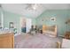 Comfortable Bedroom featuring calming colors, whimsical decorations, and a crib area for a soothing environment at 8381 E 29Th Ave, Denver, CO 80238