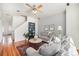 Bright living room boasting hardwood floors, stylish furniture, and a ceiling fan at 8381 E 29Th Ave, Denver, CO 80238