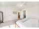 Bright main bedroom offering ample closet space, neutral carpet, and an en suite bathroom at 8381 E 29Th Ave, Denver, CO 80238