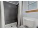 Modern bathroom featuring a tiled shower, sleek fixtures, and a clean aesthetic, offering a spa-like experience at 6119 Zenobia Ct, Arvada, CO 80003