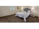 Bright and airy bedroom featuring plush carpeting, ample natural light, and stylish furnishings, ideal for relaxation at 6119 Zenobia Ct, Arvada, CO 80003