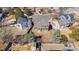 Aerial view of home with fenced backyard, large trees, and nearby houses at 616 N Brentwood Ct, Castle Rock, CO 80104
