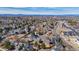 Aerial shot showcases a neighborhood with a mix of houses, trees, and landscaping at 616 N Brentwood Ct, Castle Rock, CO 80104