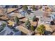 Aerial view of neighborhood showcasing mature trees, lush greenery, and manicured lawns at 616 N Brentwood Ct, Castle Rock, CO 80104